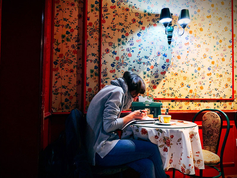 reading at cafe table