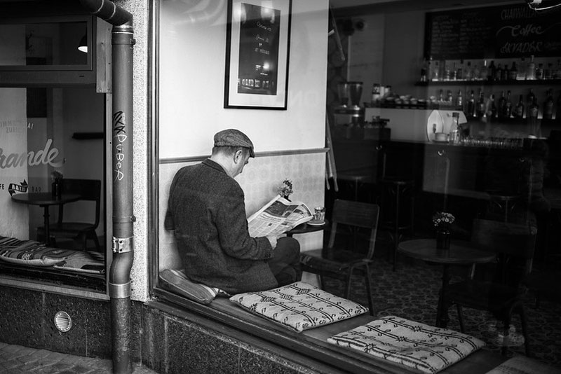 newspaper reader seated