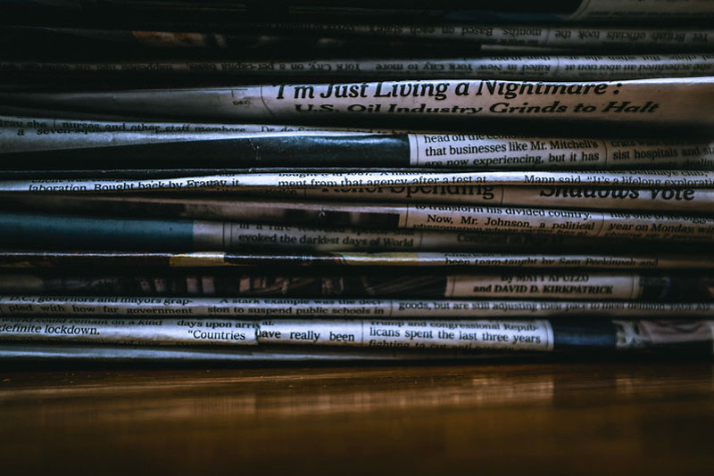 stack of newspapers - living a nightmare