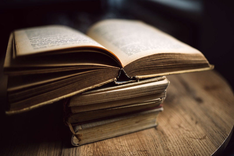 old books on wooden table